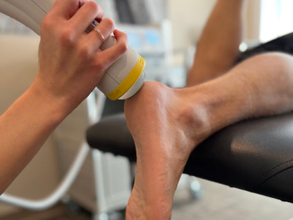 Dr. Sean Dunkle performing Softwave Therapy on a patient at Care Chiropractic in Marion IA. We serve the Marion, Cedar Rapids, Hiawatha and surrounding areas.