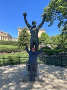 Dr. Sean Dunkle and Rocky statue. Dr. Sean works at Care Chiropractic in Marion, IA. We serve the Cedar Rapids, Hiawatha and surrounding areas.