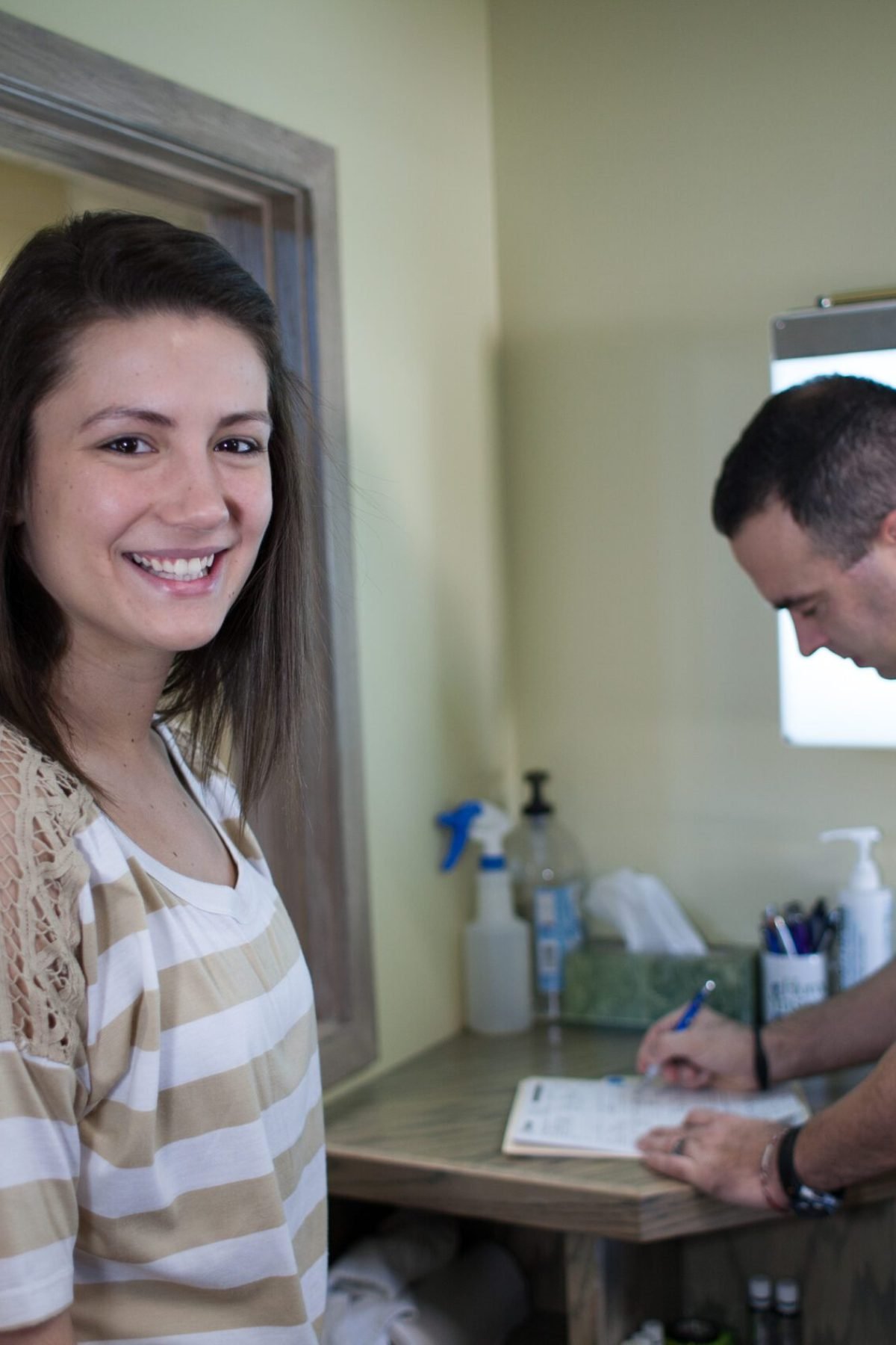 CareChiroNov2012-102 Dr. Sean Dunkle consulting with a patient at Care Chiropractic in Marion IA. We serve the Marion, Cedar Rapids, Hiawatha and surrounding areas.